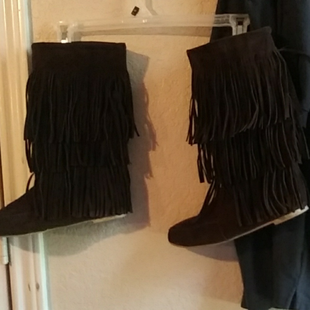 Knee high suede fringed boots